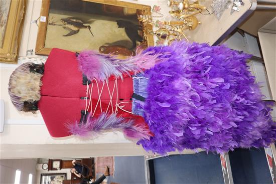 The Magic Flute: Papagenas pink, lilac and purple bodice with matching feather skirt and feathered bird headdress,